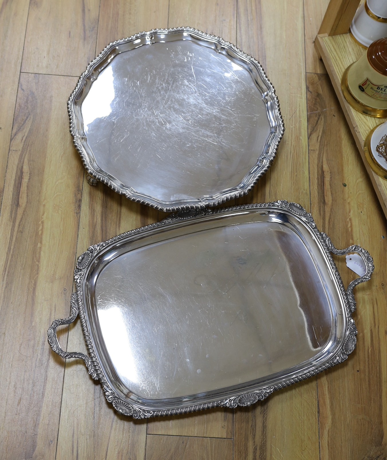 A large silver plated two handled tray and a similar salver, tray 65 cms wide